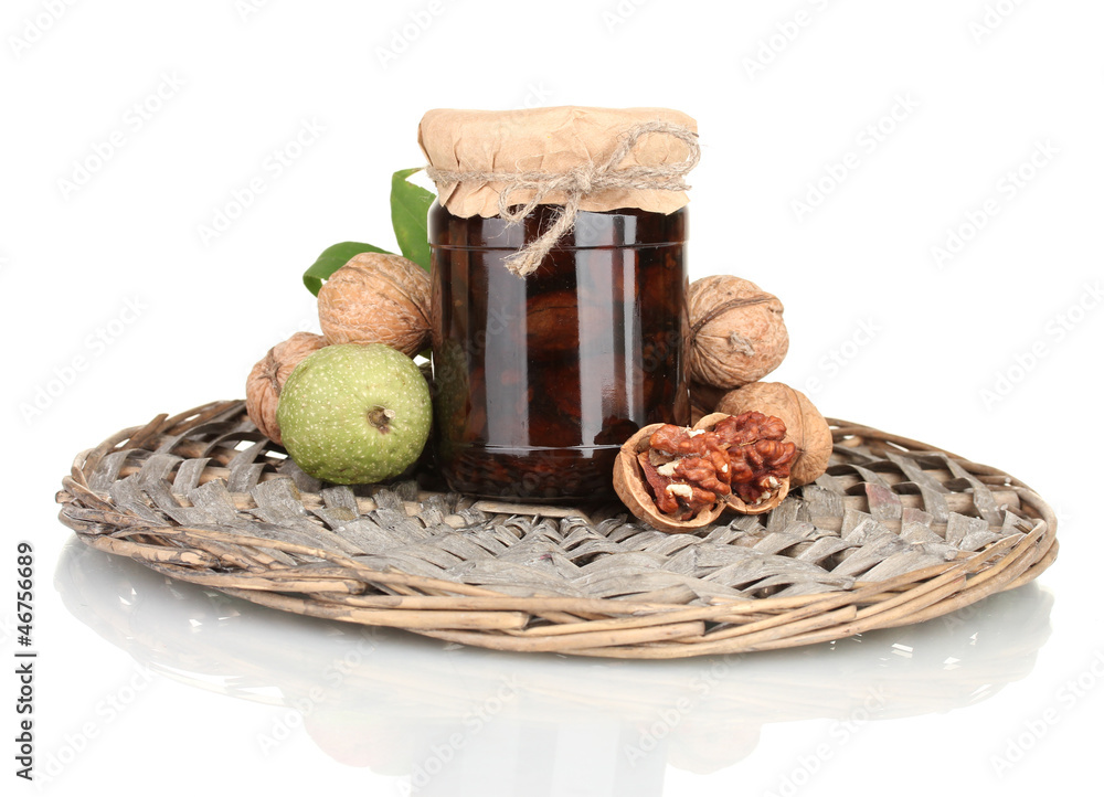 jam-jar of walnuts  on wicker mat