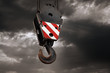 canvas print picture - Crane hook on a dramatic sky background