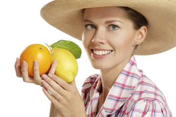 young woman  showing citrus