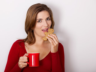 Canvas Print - Woman drinking coffee with cookies