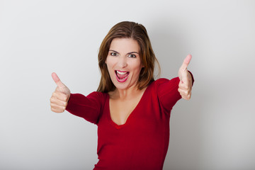 Wall Mural - Happy woman with thumbs up