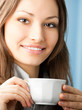 © vgstudio - Cheerful smiling business woman with coffee