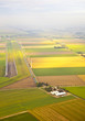 Several windmills and farm at Dutch landscape from above