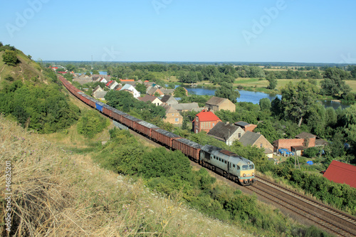 Obraz w ramie Landscape with the train, village and river