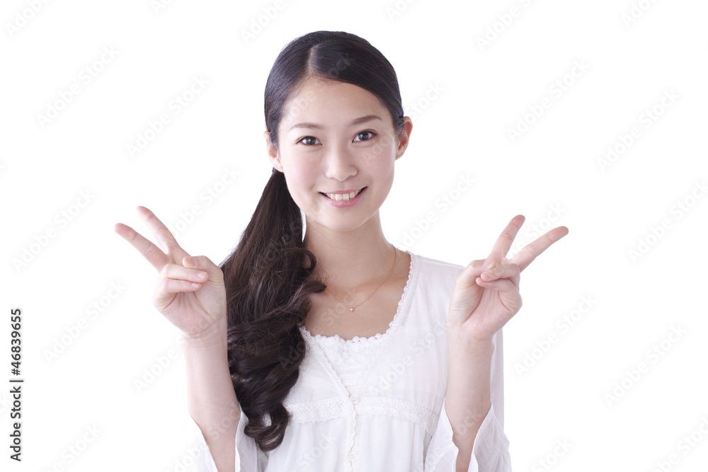 ピースサインをする若い女の子 Stock Photo | Adobe Stock
