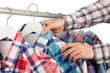 © mikelaptev - Man in checked shirt choosing another checked shirt