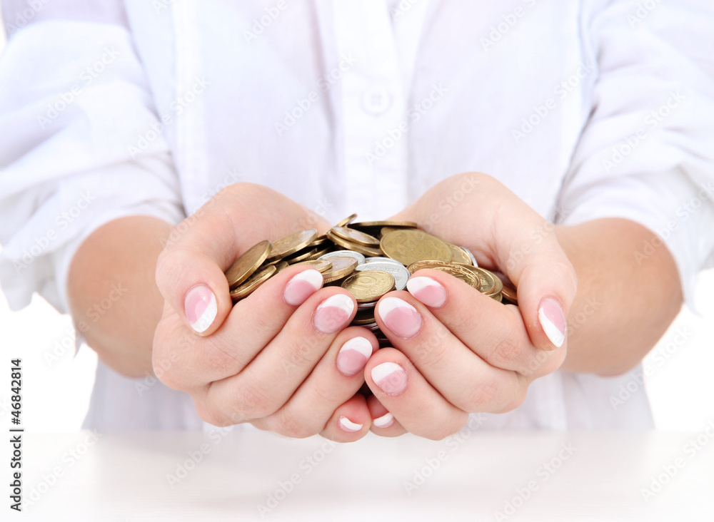 Woman hands with coins isolated on white