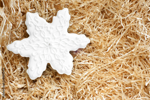 Fotografia, Obraz Christmas gingerbread cookie made in the shape of a snowflake