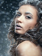 Portrait of young woman with snow make-up. Christmas snow queen