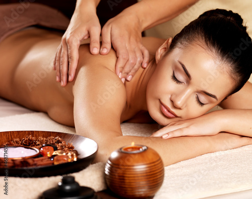 Naklejka na kafelki Woman having massage in the spa salon