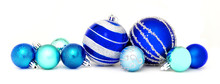Group Of Blue Christmas Baubles Arranged As A Border Over White