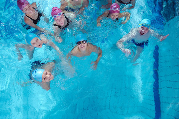 Canvas Print - happy children group  at swimming pool