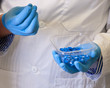© Viktorus - Scientists hand holds disposable caps for chromatography