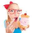Funny girl eating a cream puff