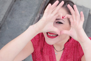 Loving portrait of a smiling girl with red lipstic