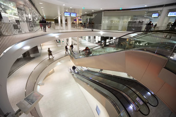 Wall Mural - Escalator and people at three floors in shopping center