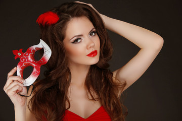 Canvas Print - Beautiful Woman with red lips holding Carnival mask in hand.