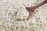 Fototapeta  - rice grains and spoon