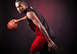 © cristovao31 - Portrait of a young male basketball player against black backgr
