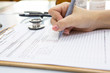 © jannoon028 - Doctor hand writing a medical recipe