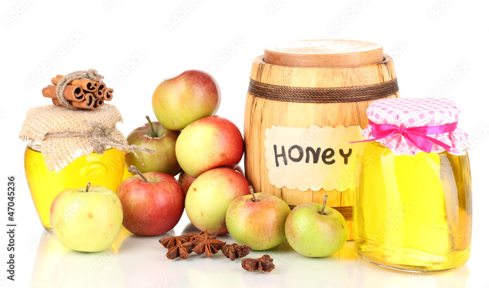 Honey and apples with cinnamon isolated on white