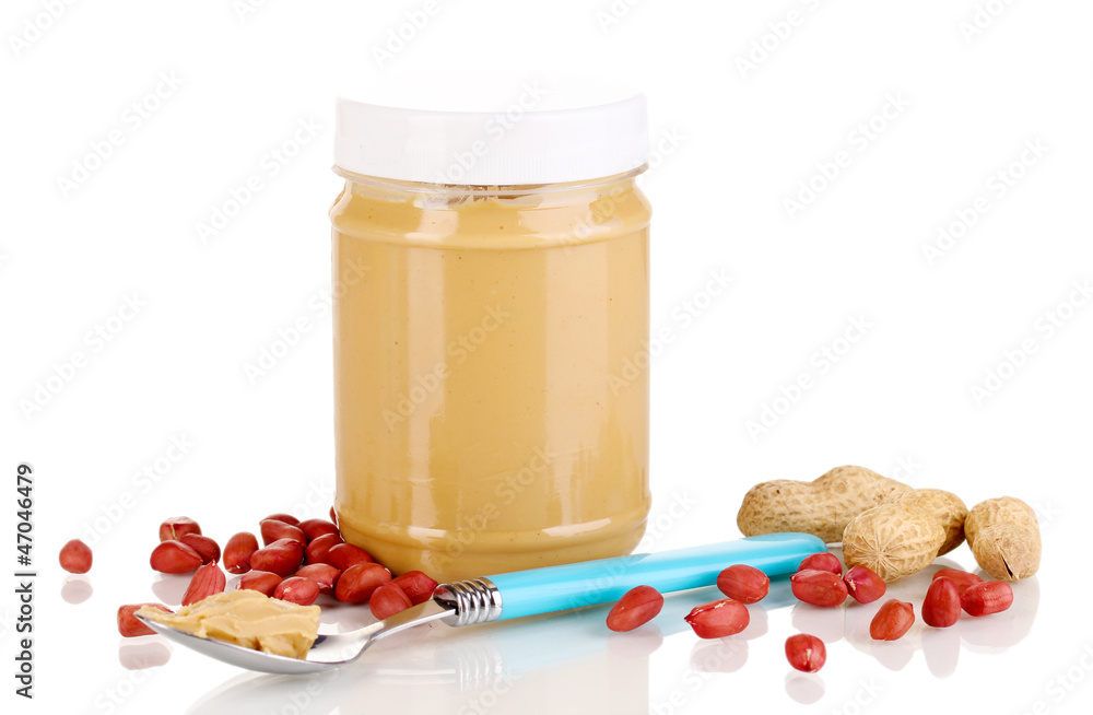Delicious peanut butter in jar isolated on white