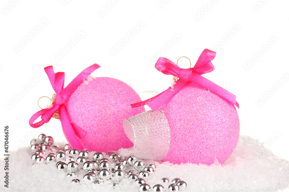 beautiful bright Christmas balls on snow, isolated on white