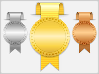 Golden, silver and bronze medals with ribbons