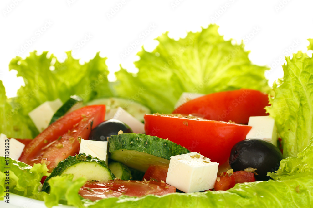 tasty greek salad on white background close-up