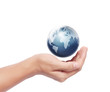 © denphumi - earth in human hand