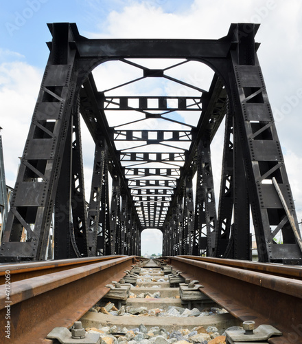 Naklejka ścienna Old railway bridge in low angle view