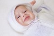 © ivolodina - Portrait of the crying baby in a knitted suit (2 months)