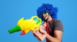 © Eugenio Marongiu - Funny guy with blue wig and water gun