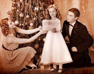 Wall Mural - Family with children  dressing Christmas tree.