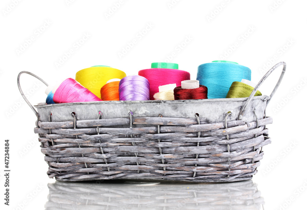 Bright threads in basket isolated on white