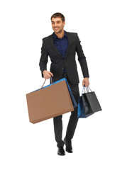 Poster - handsome man in suit with shopping bags