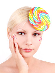 Wall Mural - portrait of blonde young girl with lollipop fashion makeup