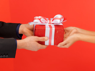 Poster - man and woman's hands with gift box