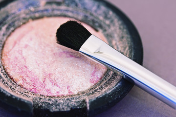 pink eyeshadow powder and brush