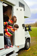 © Iuliia Sokolovska - Happy kids inr camper (RV), family vacation trip in motorhome