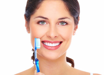 Wall Mural - Beautiful woman smile with a toothbrush.