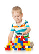 © Oksana Kuzmina - Child boy playing toy blocks isolated on white