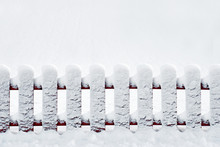 With Red Wooden Fence Covered In Snow