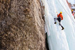 © Maygutyak - Man climbing frozen waterfall