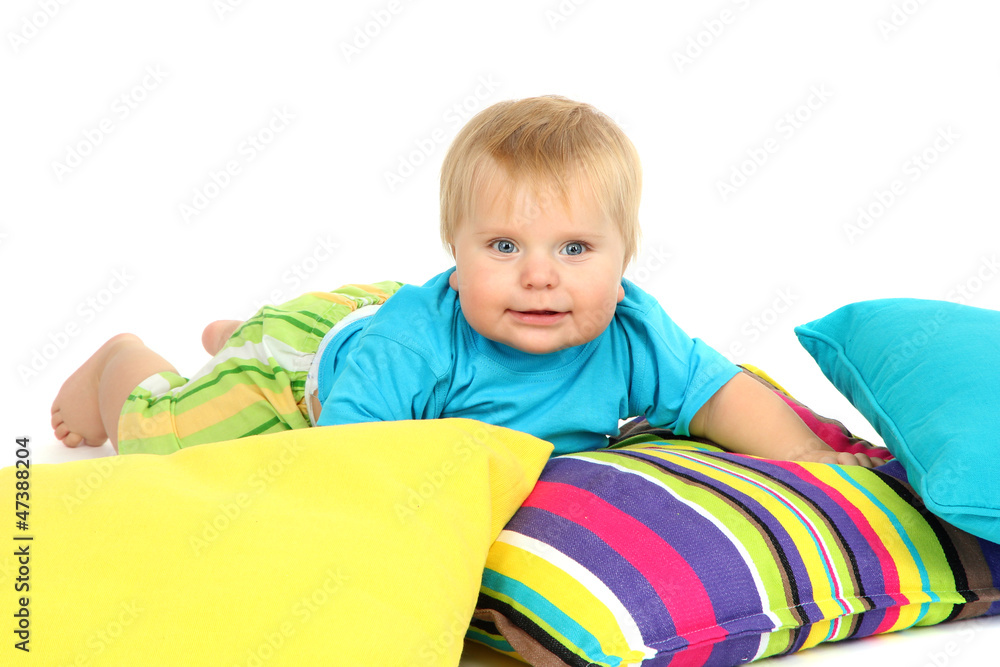 Little boy and color pillows, isolated on white