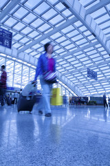 Poster - Passengers walk at the Beijing International Airport