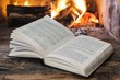 Fire in a fireplace with open book