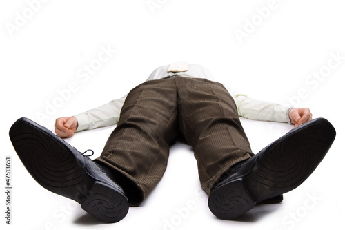 Young businessman lying on the floor