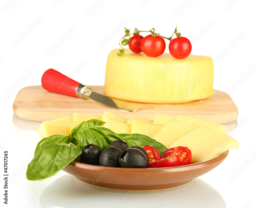sliced mozzarella cheese with vegetables in the plate isolated
