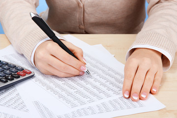 Closeup of businesswoman hands, working in office room